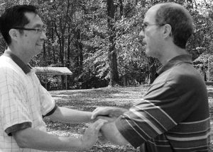 Kirk Talbott playing T'ai Chi with fellow T'ai Chi player at Cabin John Park