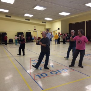 Chuck Lippman, Assistant Instructor leads a community T'ai Chi practice session at Schweinhaut Recreation Center in Montgomery County, Maryland.