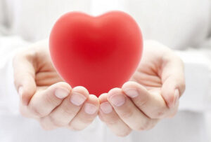 Tai Chi hands holding healthy heart
